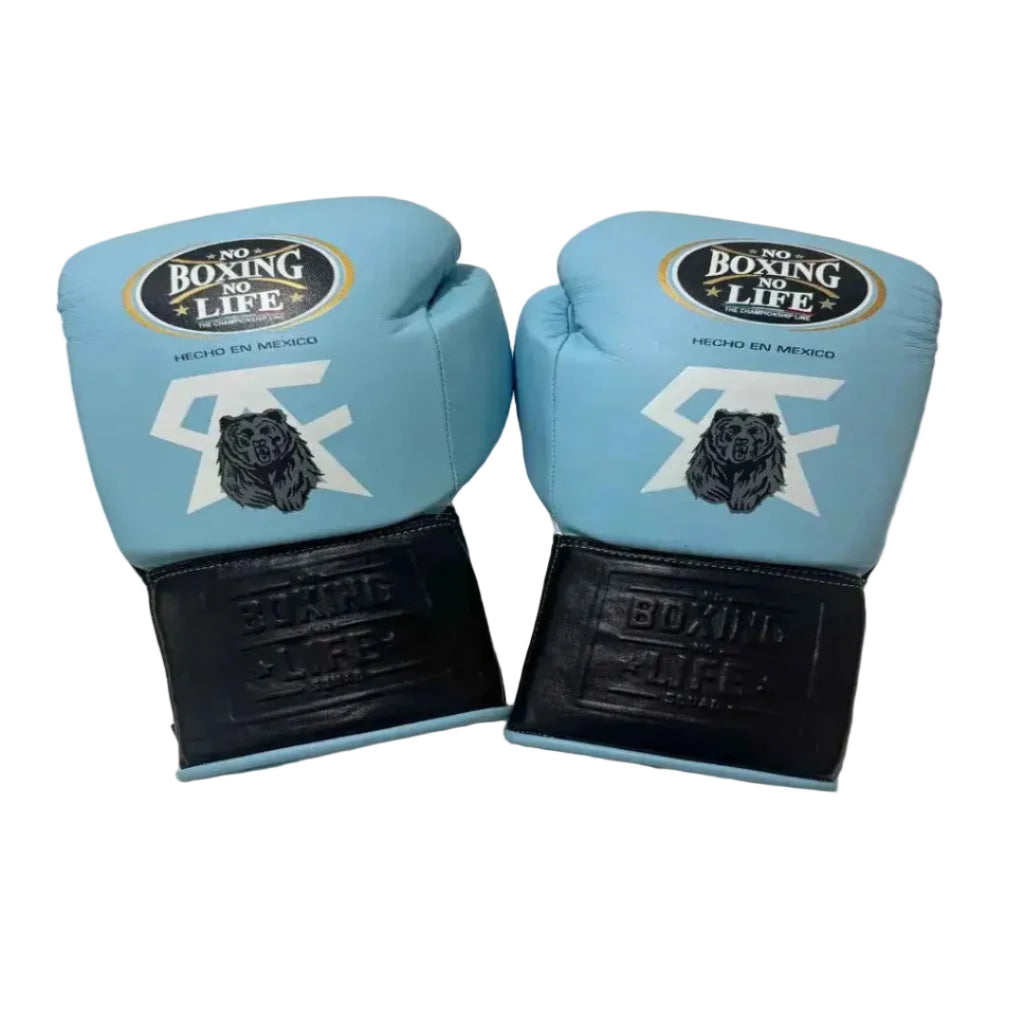 Pair of blue boxing gloves with black soles on a light background