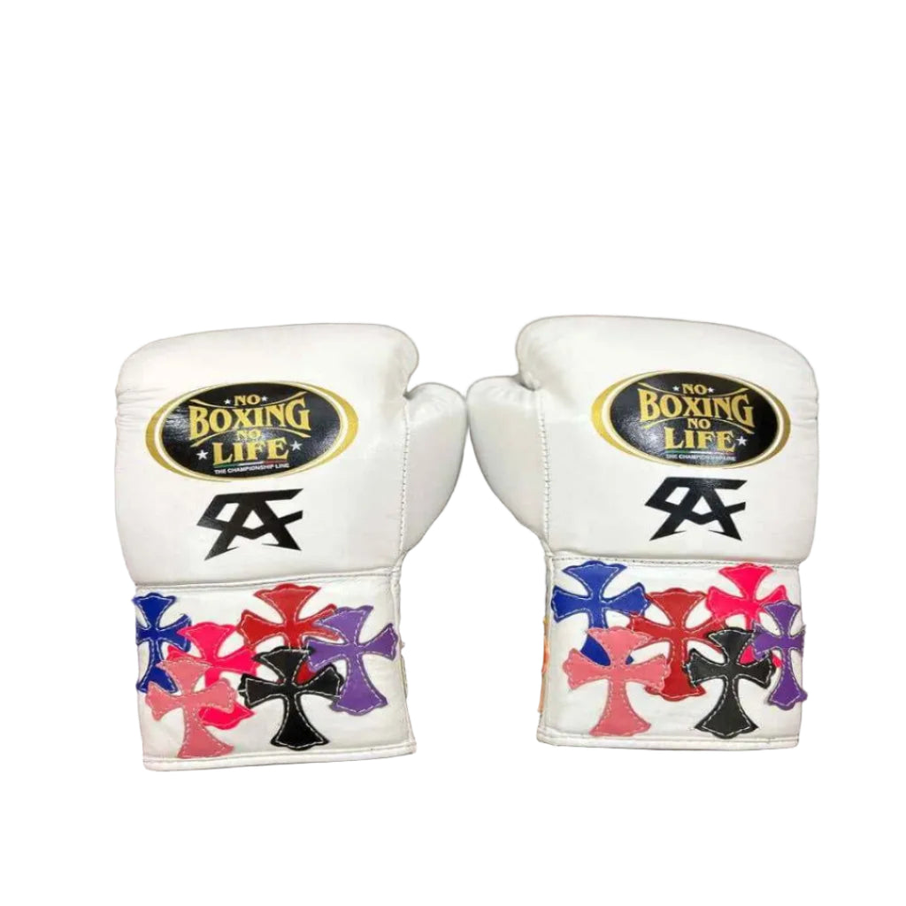Pair of white boxing gloves with colorful designs on a wooden surface
