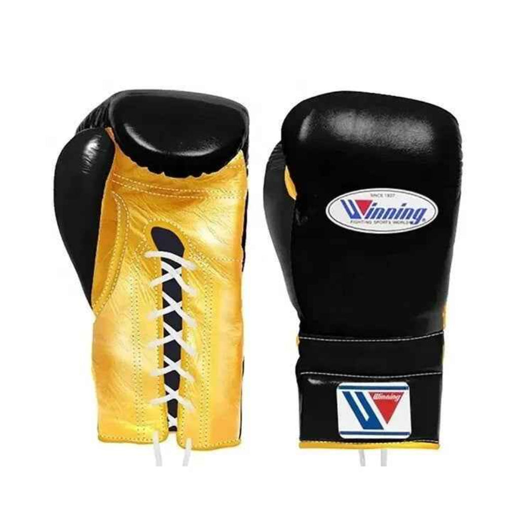 Pair of black and yellow boxing gloves with a visible brand logo on a white background