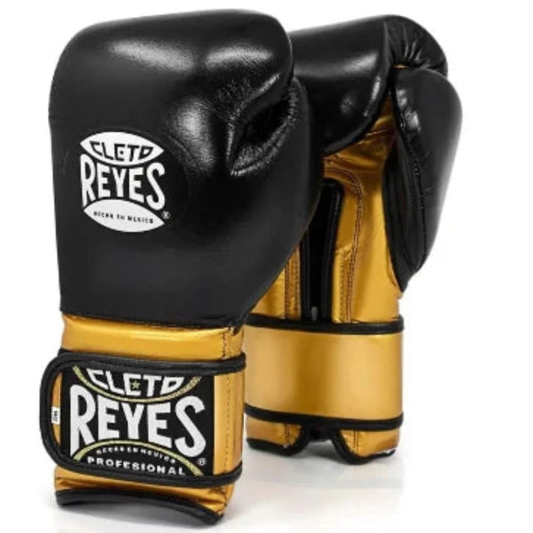 A pair of Cleto Reyes professional boxing gloves in black and gold leather, displayed against a clean white background.