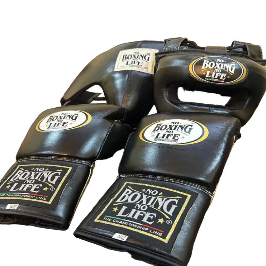 Black boxing gloves with 'No Boxing No Life' branding on a wooden table.