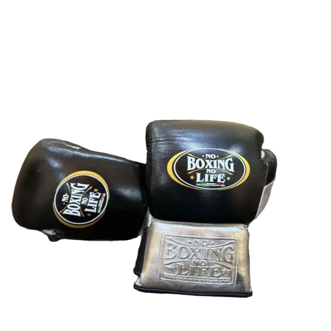 Pair of black boxing gloves with 'No Boxing No Life' branding on a wooden table.