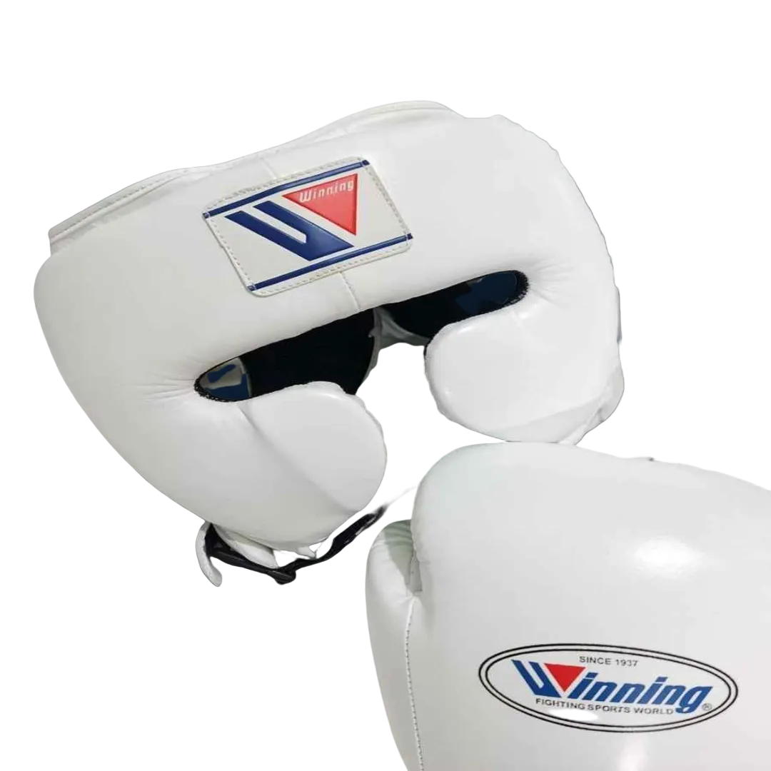 A set of red boxing protective gear including a pair of boxing gloves, a headguard, a chest guard, and a shin guard, all with the Winning brand logo, displayed against a dark background.
