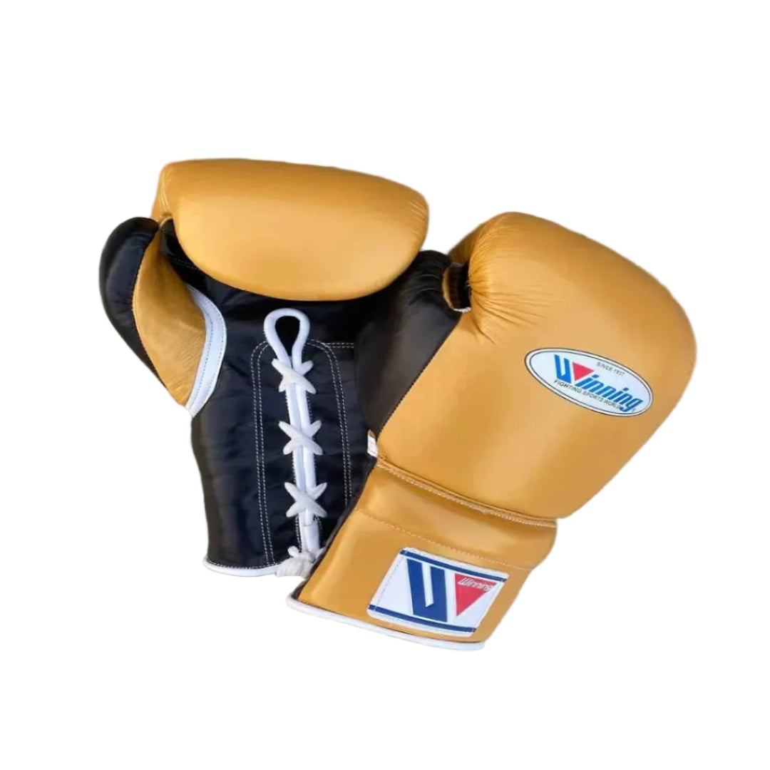 Pair of tan boxing gloves with a brand logo on a wooden surface