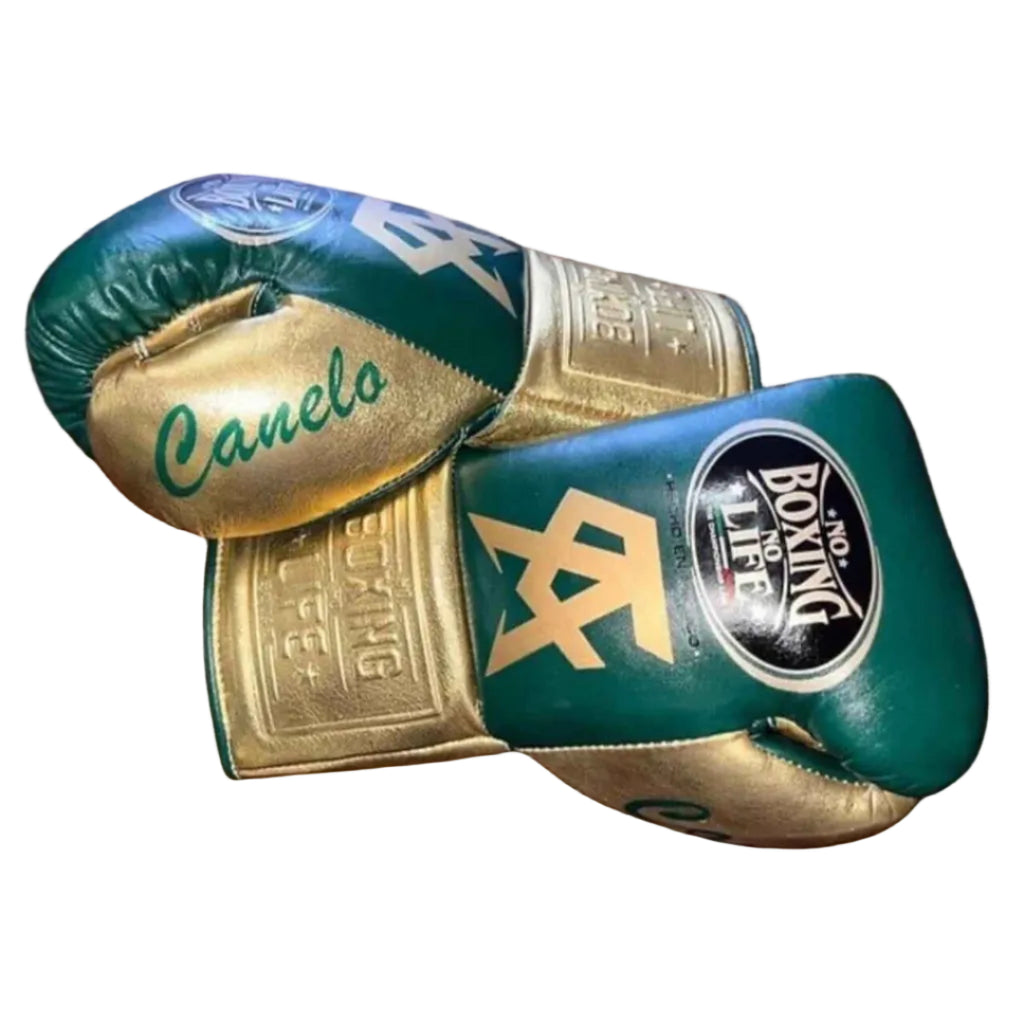 Green and gold boxing gloves with 'Canelo' branding on a wooden surface