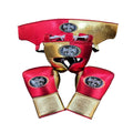 Red and gold boxing gloves with 'The Boxing Life' logo on a wooden surface