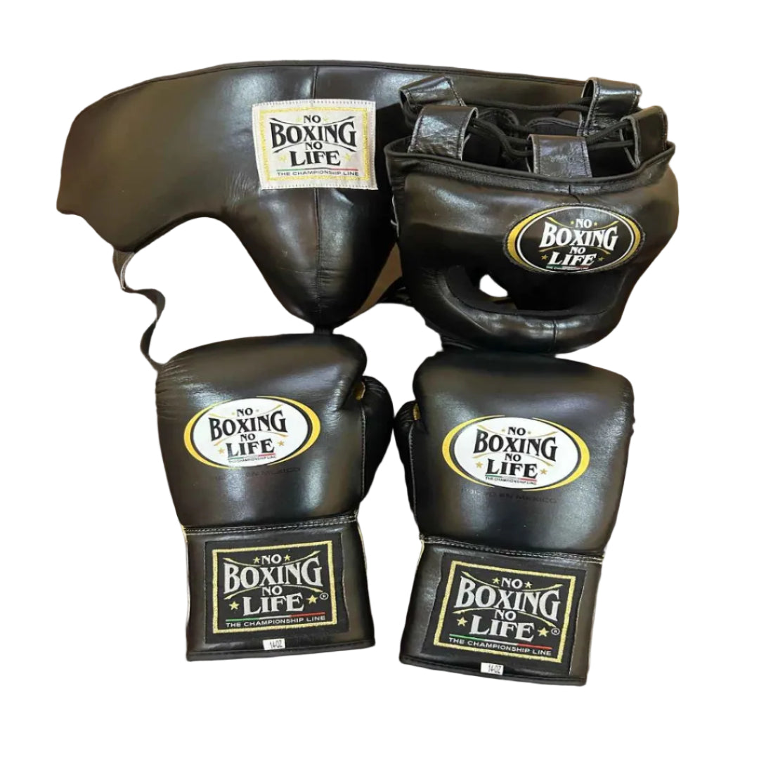 Black boxing gloves and headgear with 'No Boxing Life' branding on a wooden surface.