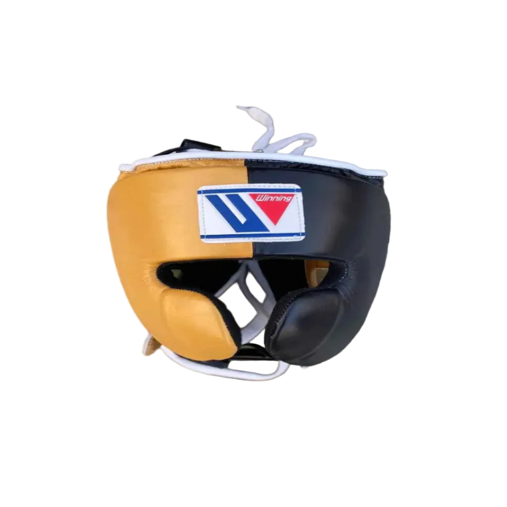 Boxing headgear with a brand logo on a wooden surface