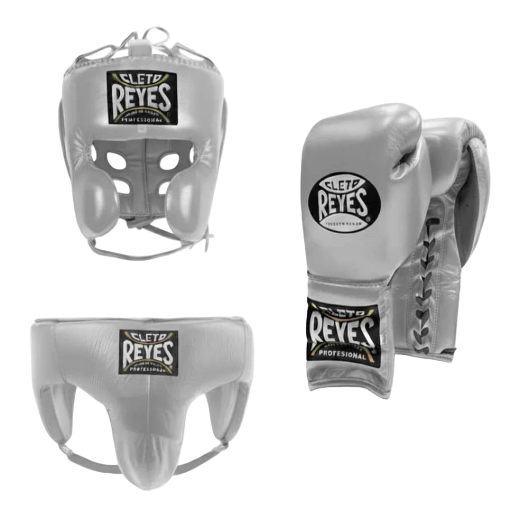 Cleto Reyes boxing headgear, chest protector, and gloves on a white background