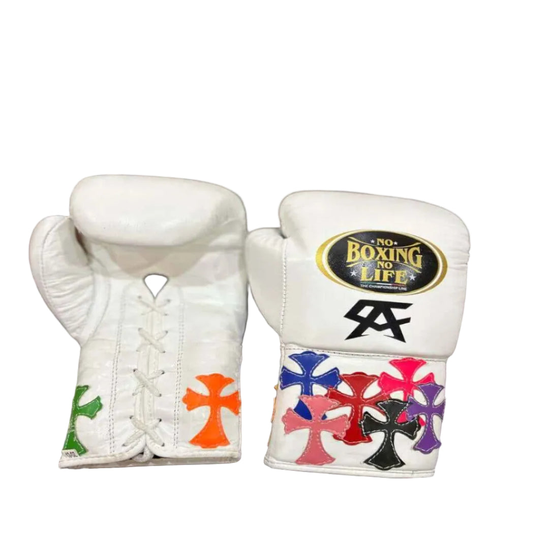 Pair of white boxing gloves with colorful designs on a wooden surface