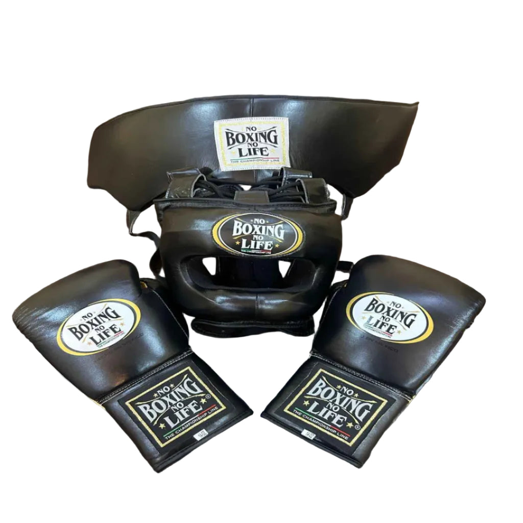 Black boxing headgear and gloves with 'No Boxing Life' branding on a wooden surface.