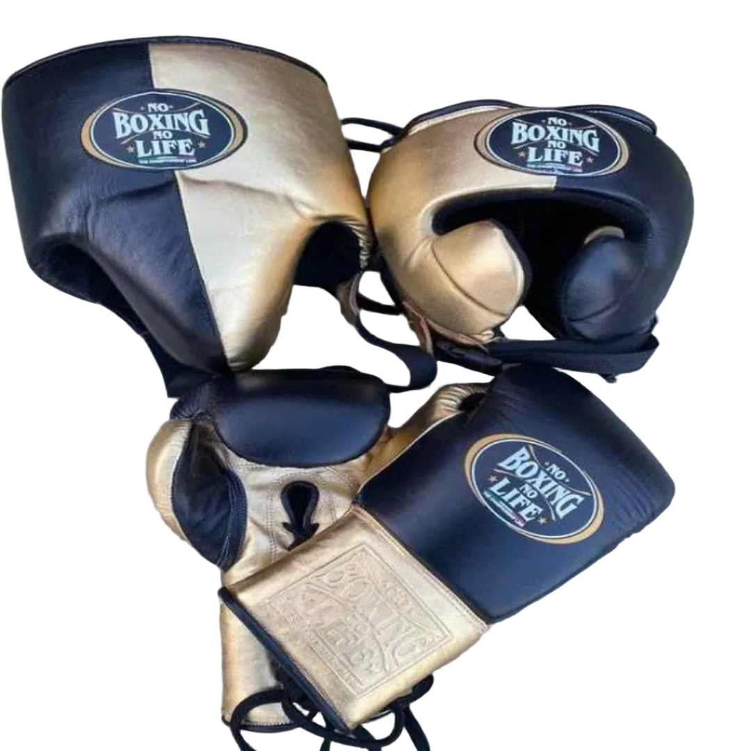 Pair of boxing gloves with 'The Boxing Life' branding on a wooden surface