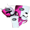 Pink and white boxing headgear and gloves with 'The Boxing Life' logo on a wooden surface.