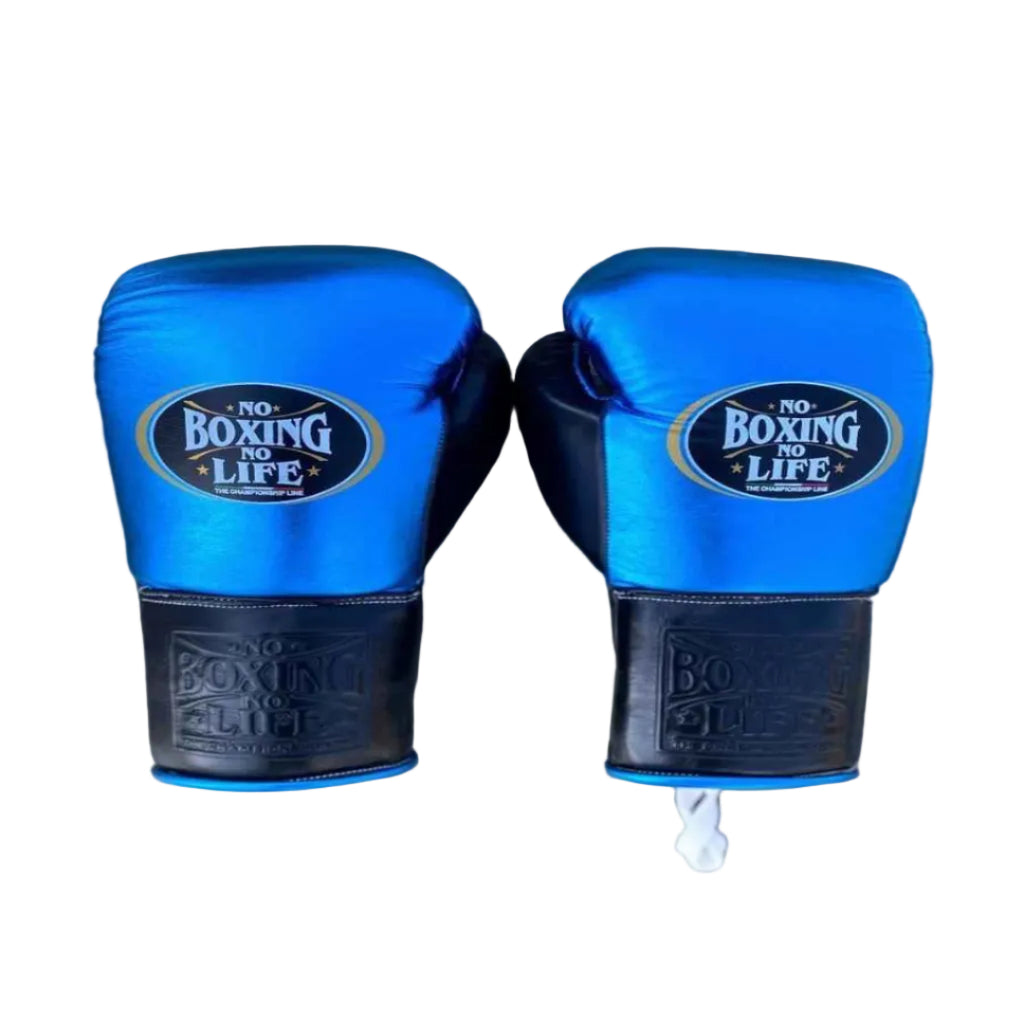 Pair of blue boxing gloves with black accents on a wooden surface