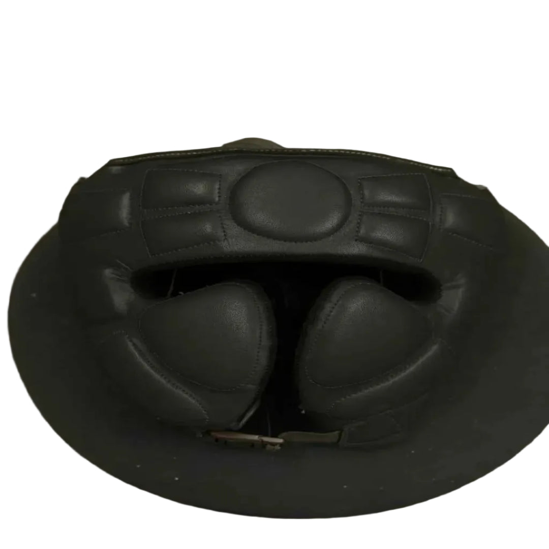 Black leather helmet on a gray surface