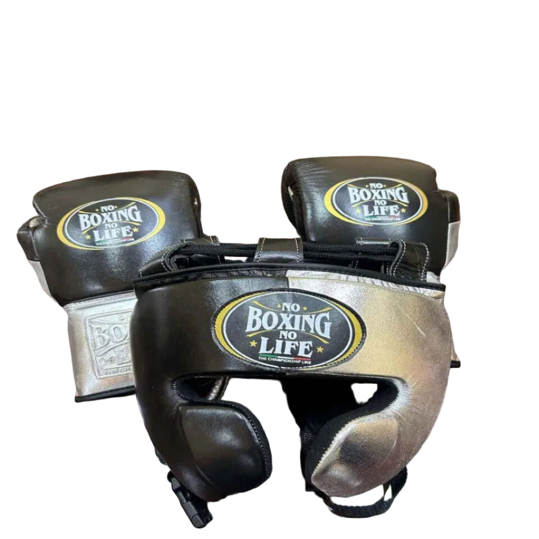 Pair of boxing gloves and headgear with 'No Boxing No Life' logo on a wooden surface.