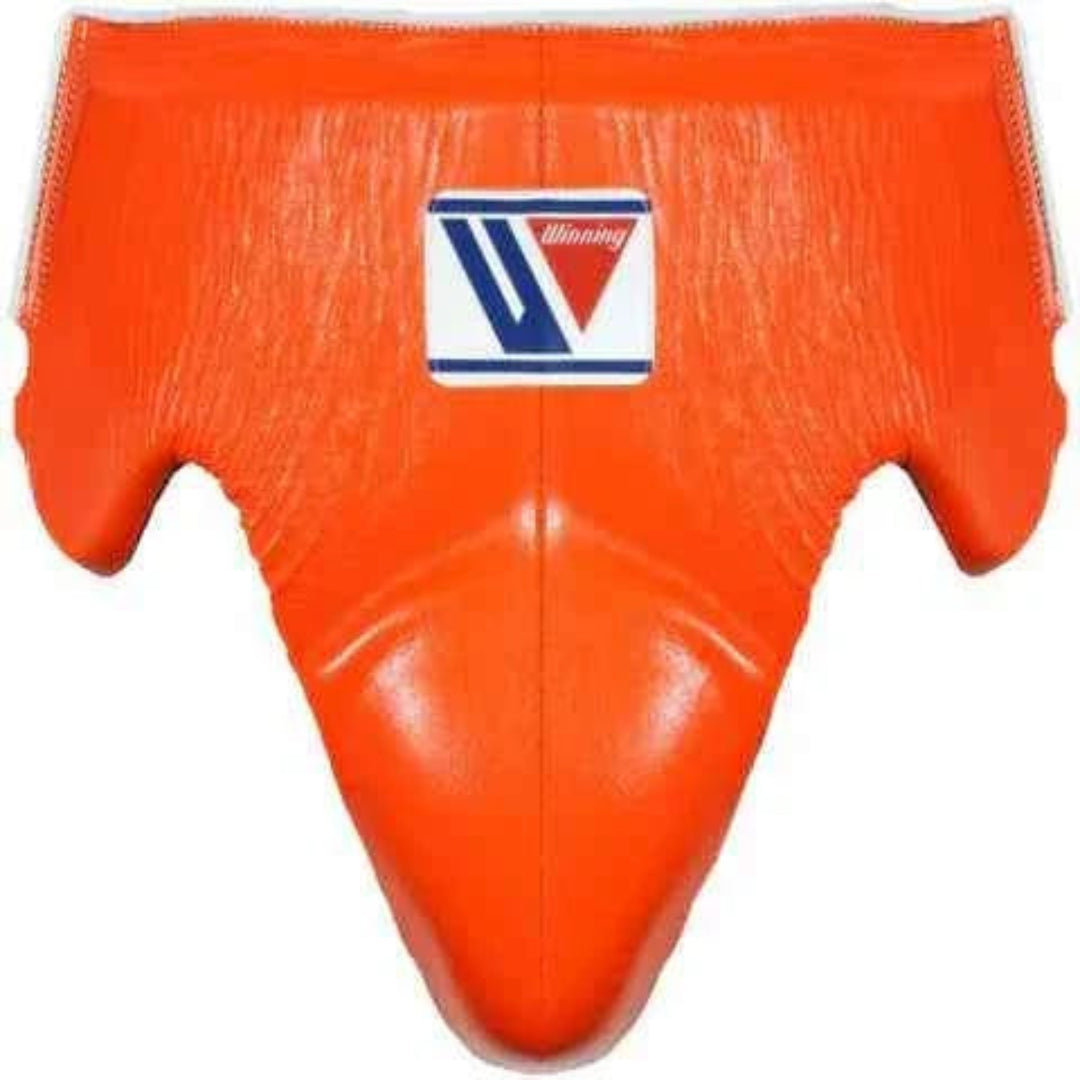 Bright orange MMA grappling pad with a central logo patch featuring the brand 'Winning'.
