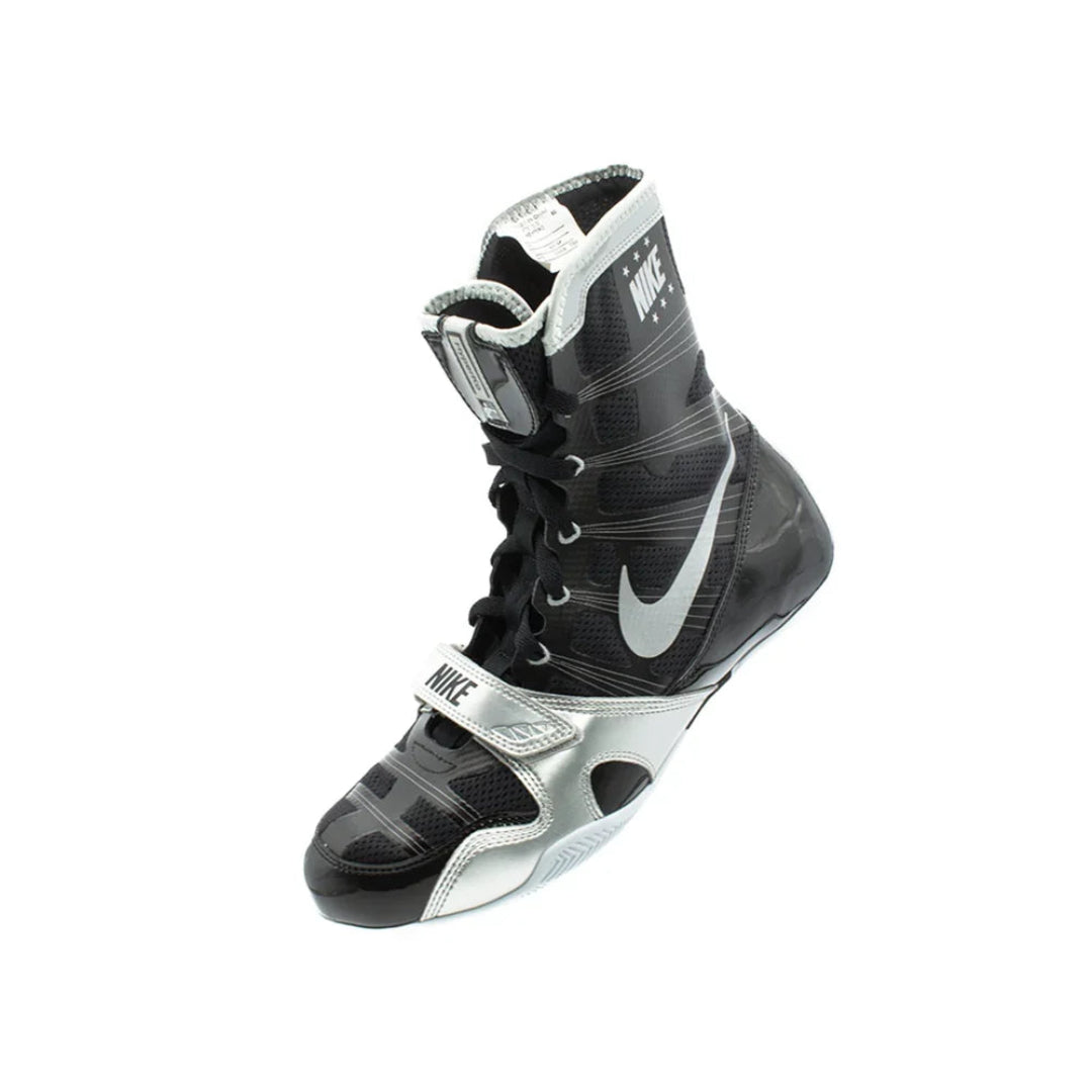 Black and silver boxing shoe with Nike logo on a white background
