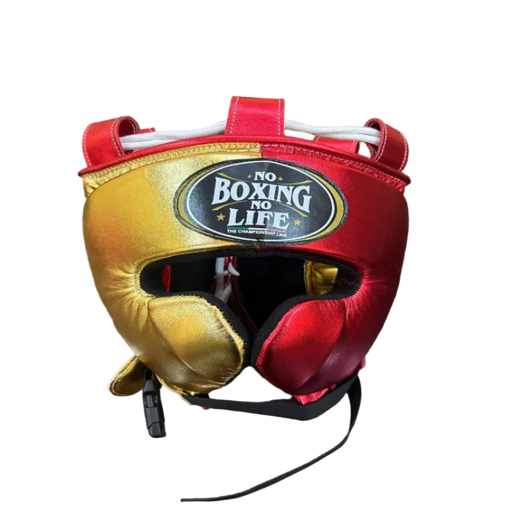 Red and gold boxing headgear with 'No Boxing No Life' logo on a wooden surface