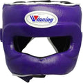 A purple boxing headguard with a white and blue Winning logo patch on the forehead, shown against a plain white background.