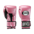 Pink boxing gloves with 'Cleto Reyes' branding on a white background