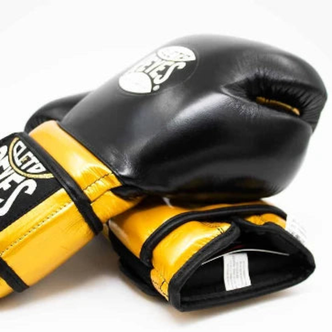 Black and yellow boxing gloves with a brand logo on a white background