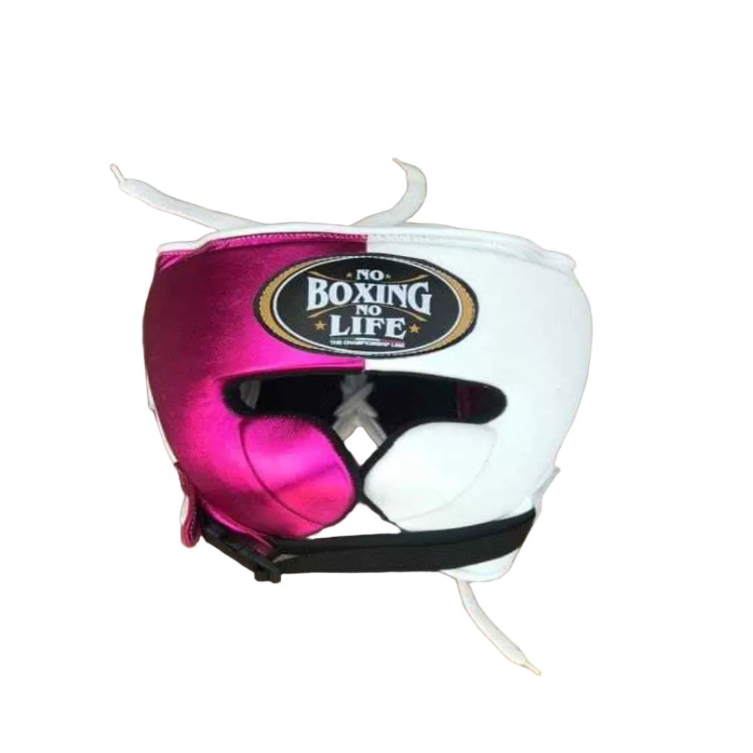 Pink and white boxing headgear with 'No Boxing No Life' logo on a wooden floor.