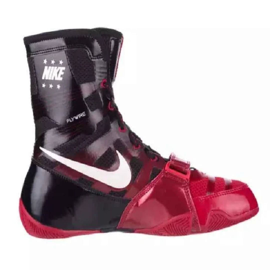 A Nike high-top boxing shoe in black and red with a prominent white Swoosh logo on the side, set against a plain white background.