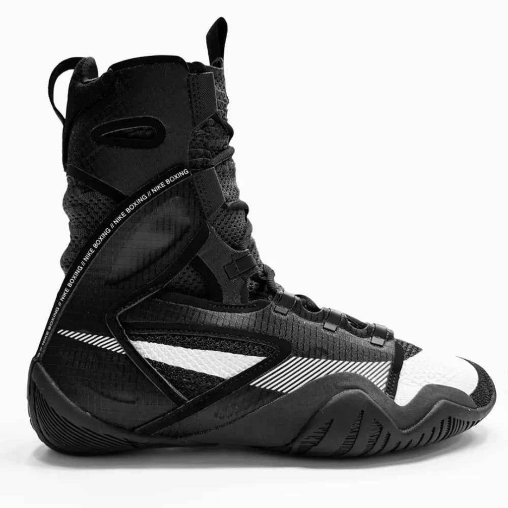 Black high-top sneaker with white accents on a white background