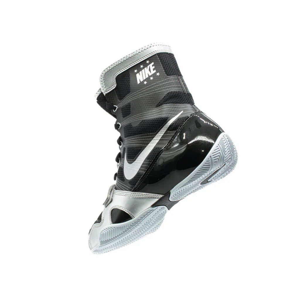 Black and gray Nike boxing shoe on a white background