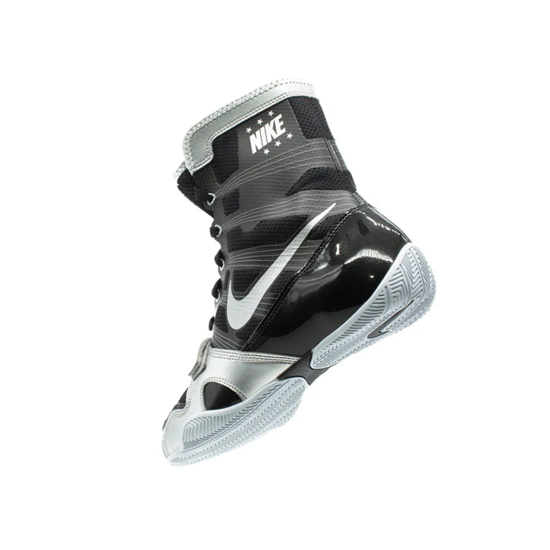 Black and gray Nike boxing shoe on a white background