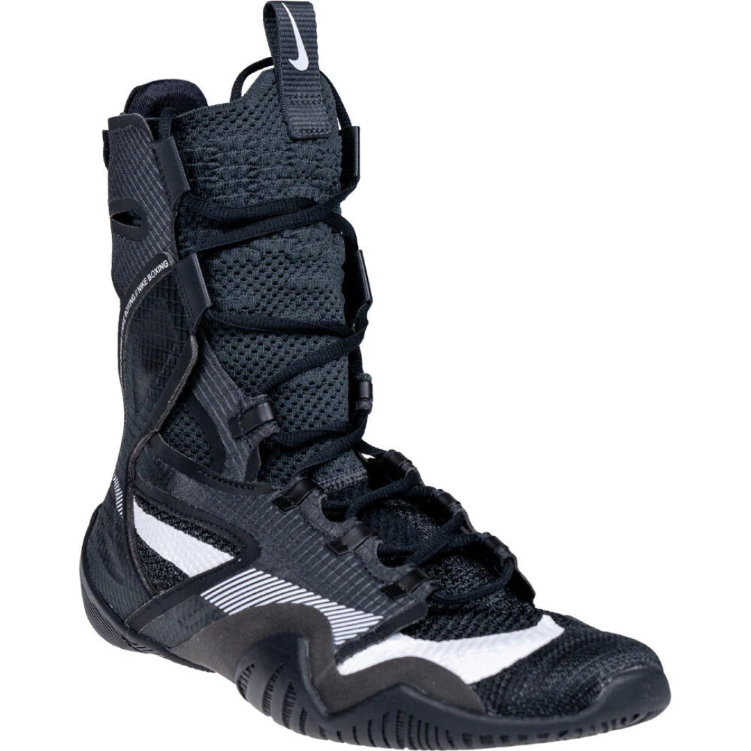 A black athletic boot with a white Nike swoosh on the pull tab and a white side stripe, shown against a plain white background.