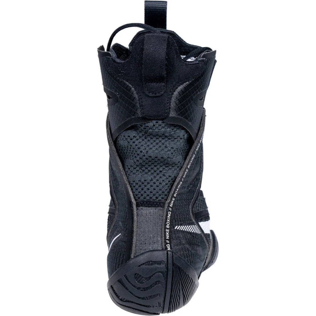 A black high-top protective boot with textured mesh panels, a pull tab at the top, and a rugged sole, shown against a plain white background.