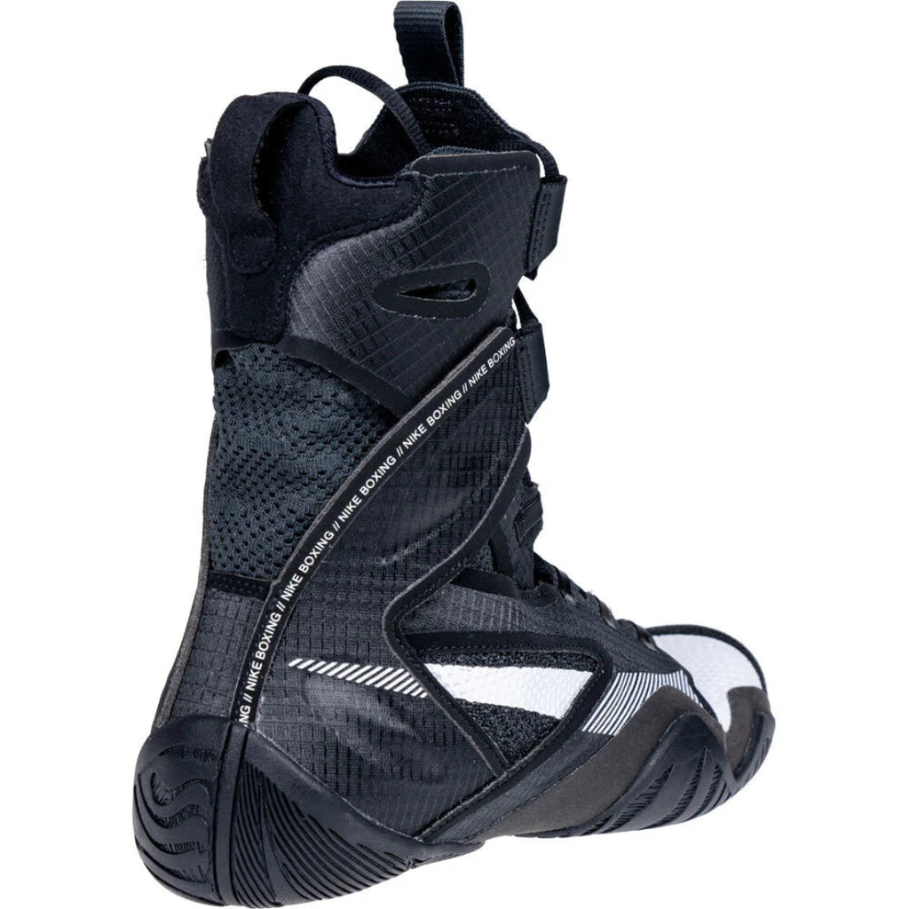 A high-top black athletic boot with textured panels, mesh details, and white branding text reading 'Three Board' on the side, shown against a plain white background.