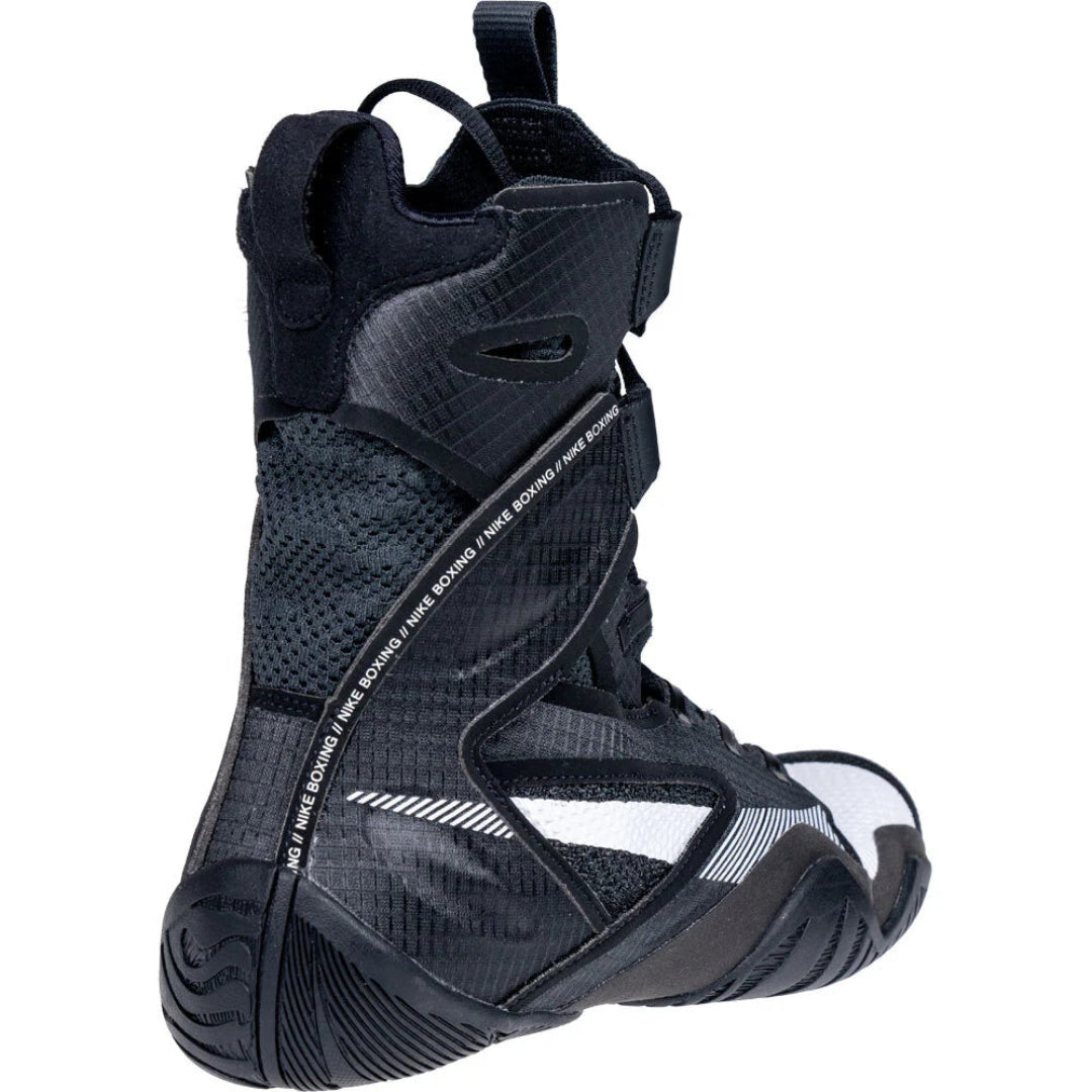 A high-top black athletic boot with textured panels, mesh details, and white branding text reading 'Three Board' on the side, shown against a plain white background.